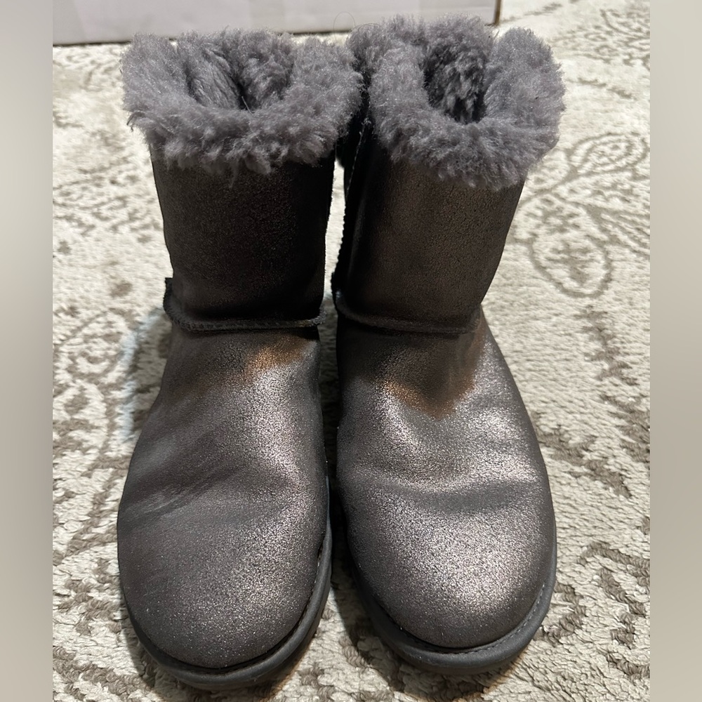 Women’s Ugg boots size 8.  Gray with metallic finish and bow detail (used)